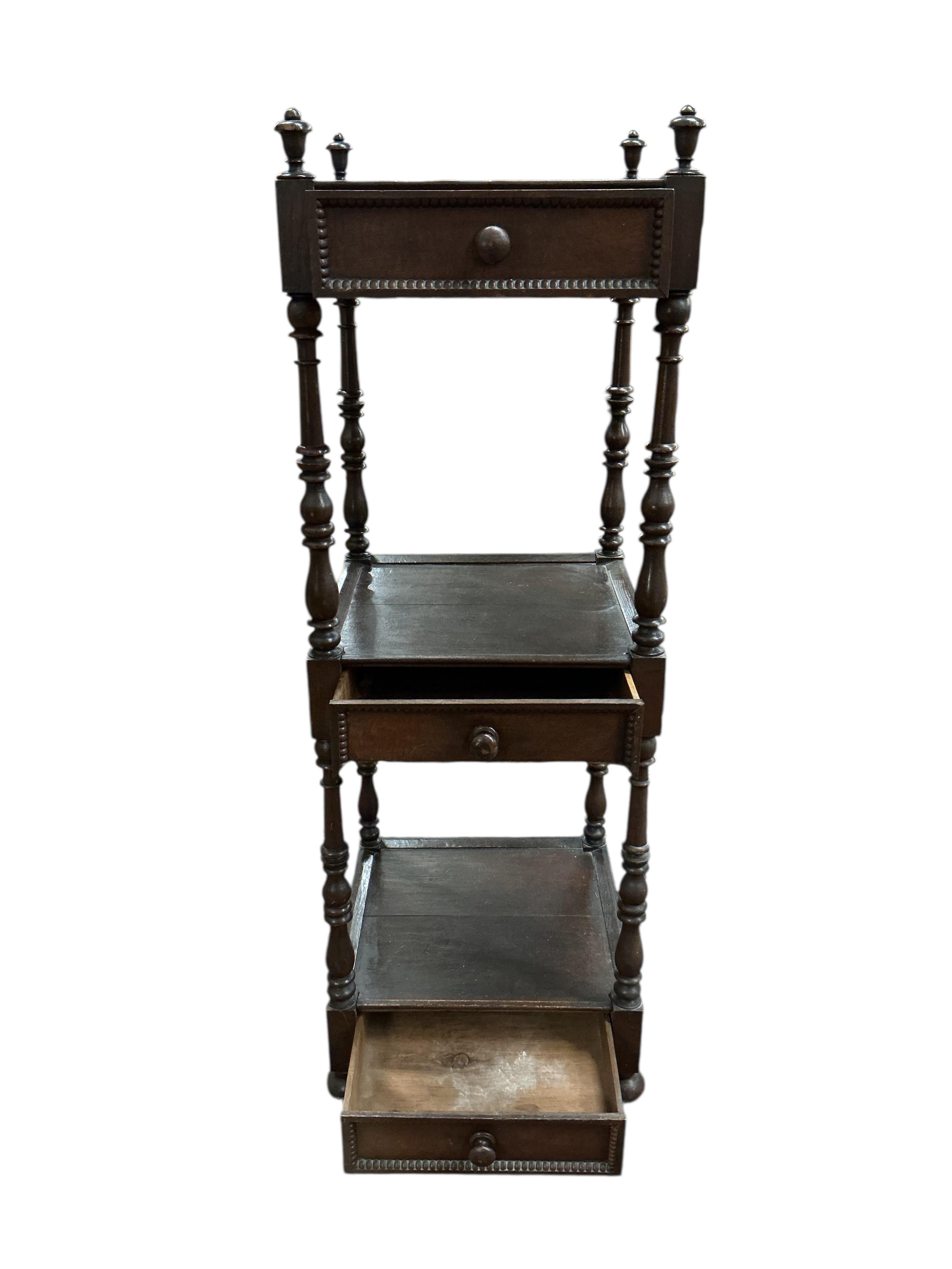A Regency style oak three tier whatnot, width 46cm, height 136cm